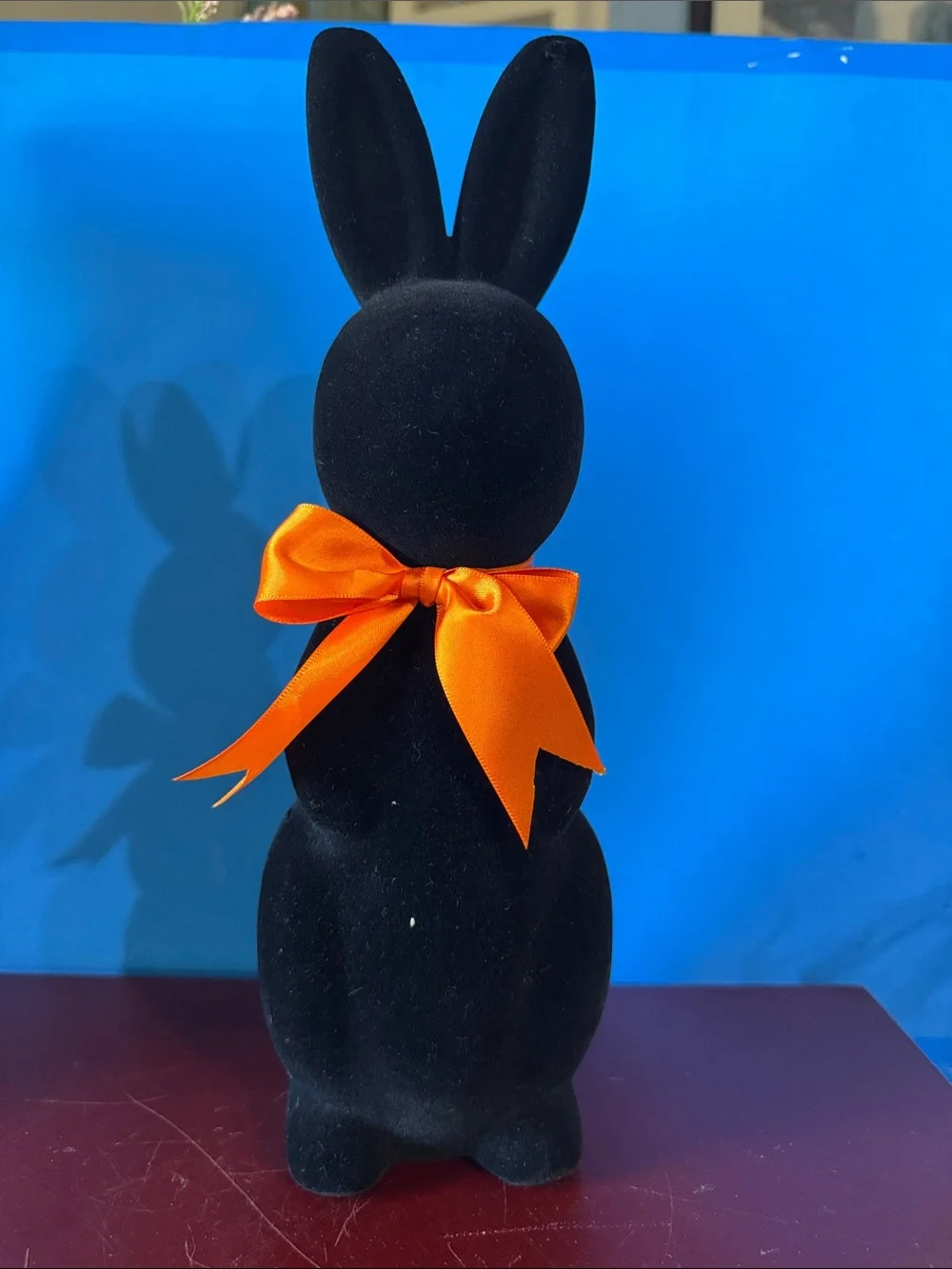 Black flocked (fuzzy) bunny figurine w/orange bow contemporary Easter- NEW